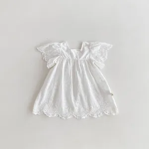 Detail of white baby girl cotton lace flutter sleeve dress, soft breathable fabric summer.
