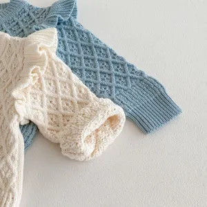 Infant diamond knit cardigan detail, soft cotton texture with cute ruffle flying sleeves.