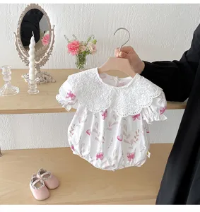 Cute baby girl summer romper with delicate lace collar and sweet pink butterfly print design.