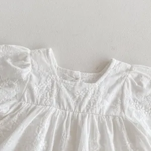 Infant baby girl cotton lace embroidered dress detail view, sweet white flying sleeve romper.