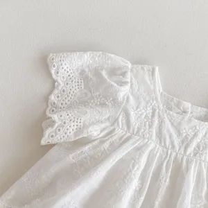 Detailed view of white baby girl cotton flutter sleeve romper dress with delicate embroidery lace.