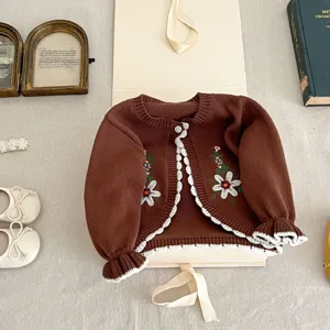 Baby girl knit cardigan detail, vintage brown cotton sweater with floral embroidery ruffles.