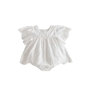 Cute white baby girl summer romper with fly sleeves and delicate lace embroidery.
