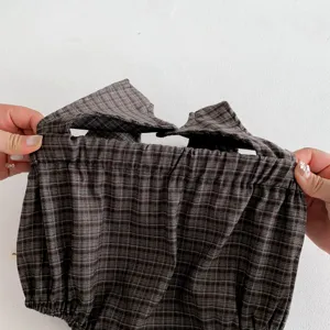 Close-up detail of the autumn infant baby girl plaid sleeveless romper showing soft texture.