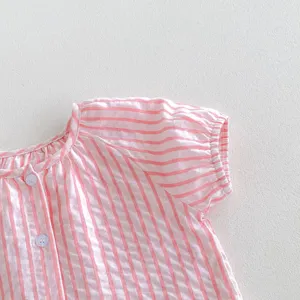 Baby girl pink striped short sleeve top detail, cute summer toddler clothing with buttons.