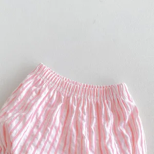 Pink and white striped baby shorts waistband detail shot showing elastic material design.