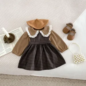 Detailed view of autumn toddler girl long sleeve top and plaid dress set with accessories.
