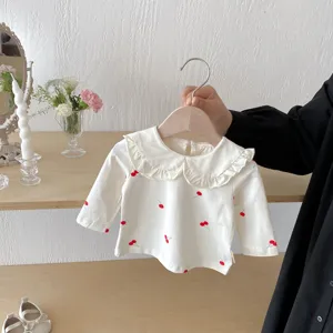 Cherry print baby girl long sleeve t shirt detail, cute ruffle collar toddler top background.
