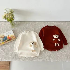 Cute baby knit romper with adorable plush bear pocket detail, cozy long sleeve baby bodysuit.