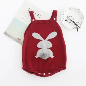 Cute baby knitted rabbit romper detail view, soft cotton baby crawler with furry tail.