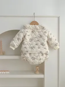 Detailed shot of baby winter quilted floral two-piece set featuring elegant lace collar.