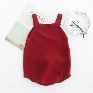 Red cotton knit baby romper, sleeveless strap newborn jumpsuit for infant daily wear.
