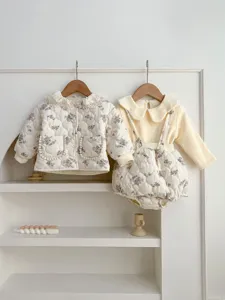 Detailed view of the Korean style baby floral quilted jacket and strap romper set for winter.