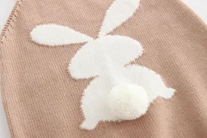 Baby girl cotton knit romper detail with cute white rabbit silhouette and fluffy pompom tail.