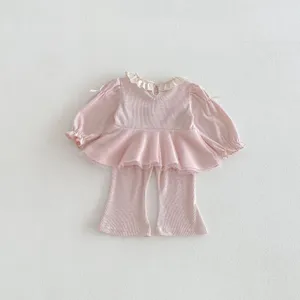 Cute toddler baby girl pink ribbed long sleeve top and flared pants two piece clothing set.