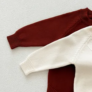 Infant baby knit long sleeve romper detail close-up showing soft texture and cozy collar design.