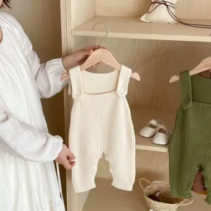Detailed view of baby knitted strap romper, soft ribbed cotton infant jumpsuit for daily wear.