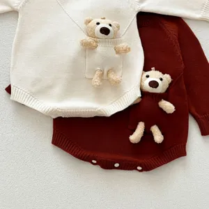 Infant baby cute bear long sleeve knitted romper detail showing pocket doll and snap buttons.