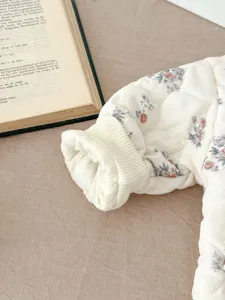Winter Korean style baby floral quilted jacket detail view with cozy ribbed cuffs and cute print.