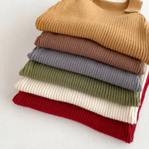Baby knitted overalls detail shot, soft wool fabric texture close-up, multiple colors.