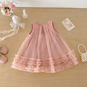 Detailed view of the cute pink toddler girl mesh dress featuring a sleeveless design and ruffles.