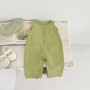 Avocado green baby jumpsuit, sleeveless infant romper with pockets, detailed close-up.
