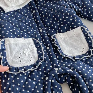 Infant winter quilted jumpsuit with cute polka dots, lace pockets, and warm fleece lining.