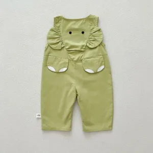 Detail shot of cute infant baby green casual overalls pants with lovely animal ears pocket.