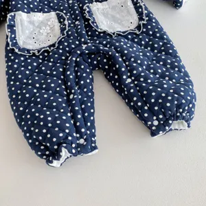 Cute baby winter fleece-lined romper detail, dark blue polka dot infant quilted crawler suit.