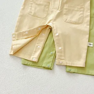 Toddler baby clothing detail shot featuring candy colors, crotch snaps and front pockets.