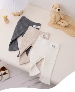 Detail shot of cute baby ribbed leggings in three classic colors, soft and comfortable knit wear.