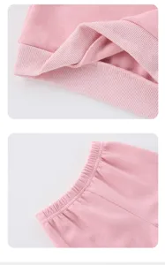 Pink kids sweatshirt and sweatpants detail shot featuring ribbed cuffs and elastic waist.