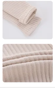 Close-up detail of soft ribbed fabric and neat stitching on baby leggings texture view.