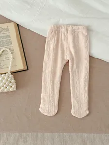 Cozy baby footed tights with soft knit texture, ideal for everyday toddler comfort and warmth.