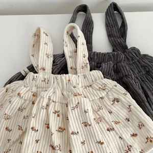 Infant baby corduroy floral strap romper detail shot, cute autumn toddler girl dress.
