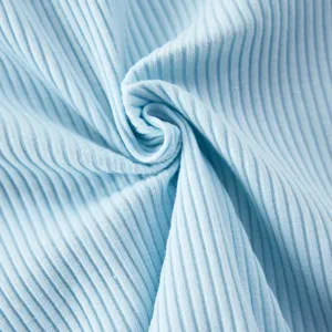 Light blue cotton rib knit fabric background for cute baby rompers and daily infant clothing.