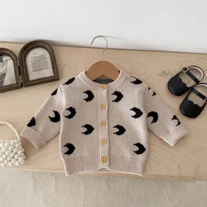Baby knit cardigan featuring allover crescent moon pattern, cute button front, soft cotton yarn.