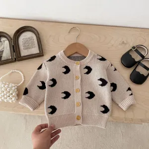 Baby knit cardigan detail, cute black moon pattern on beige cotton, spring autumn kids top.