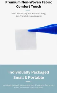 Close-up of a white alcohol prep pad being held by blue tweezers, showing its fine texture.
