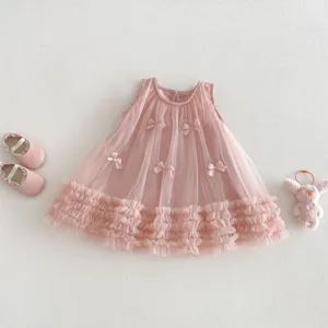 Pink sleeveless toddler girl mesh dress detail featuring cute mini bows and layered tulle hem.
