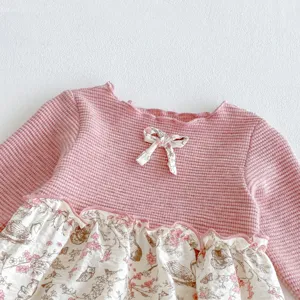 Infant baby girl long sleeve waffle romper with floral patchwork and cute bow detail for daily wear.
