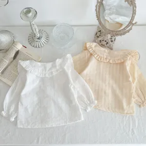 Toddler baby girl long sleeve cotton shirt detail view with chic ruffled collar and cute design.