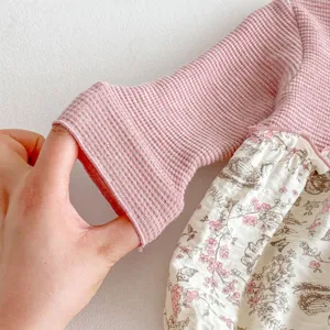 Infant baby girl waffle knit long sleeve romper detail texture pink floral print skirt close up