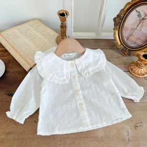Cute baby girl white long sleeve blouse with ruffled collar and front buttons, soft cotton.