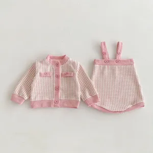 Cute infant baby girl pink checkered tweed cardigan jacket and suspender skirt outfit.