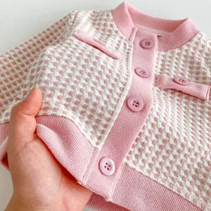 Pink white check knit baby cardigan detail, cute infant button sweater jacket for toddler girls.