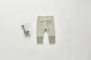 Infant striped cotton leggings detail view, showing soft ribbed cuffs and clean flat lay design.