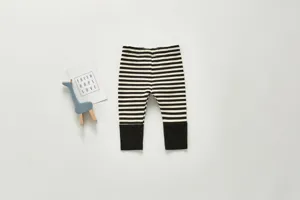 Baby striped cotton leggings detail showing the black and white pattern and cuff design.