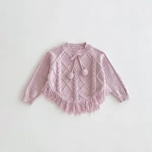 Pink girls knit sweater with cable pattern, fringe hem and cute pom-pom drawstrings.