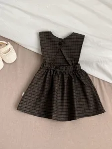 Infant baby girl plaid sleeveless dress detail view, cute retro toddler casual apparel.